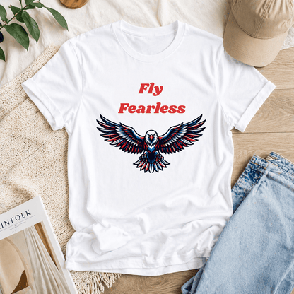 Fly Fearless white cotton t-shirt flat lay with eagle graphic print, styled lifestyle product photography with natural background