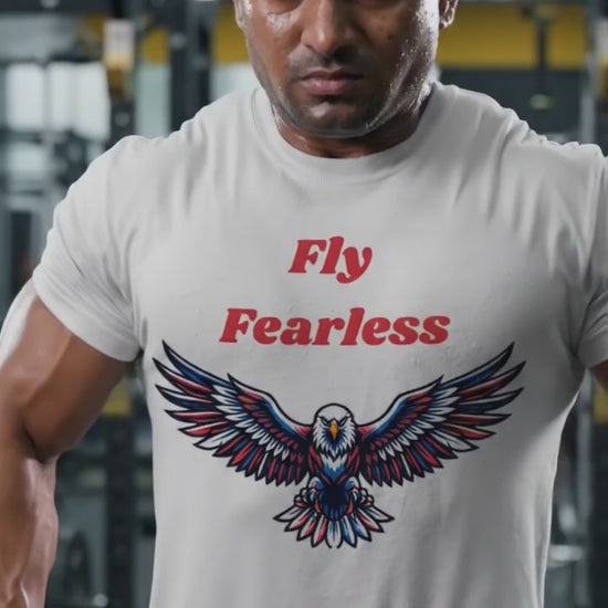 Young Indian male model in sunglasses wearing Fly Fearless white graphic t-shirt, relaxed casual outdoor lifestyle videography