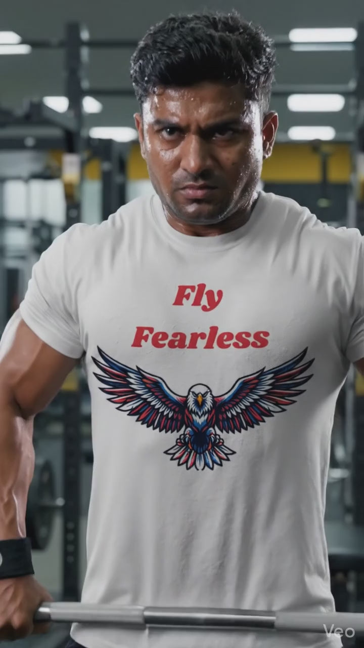 Young Indian male model in sunglasses wearing Fly Fearless white graphic t-shirt, relaxed casual outdoor lifestyle videography
