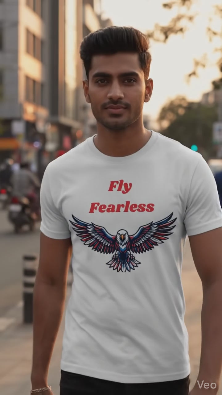 Indian male model wearing Fly Fearless white graphic t-shirt with eagle print outdoors on urban street, casual lifestyle fashion videography